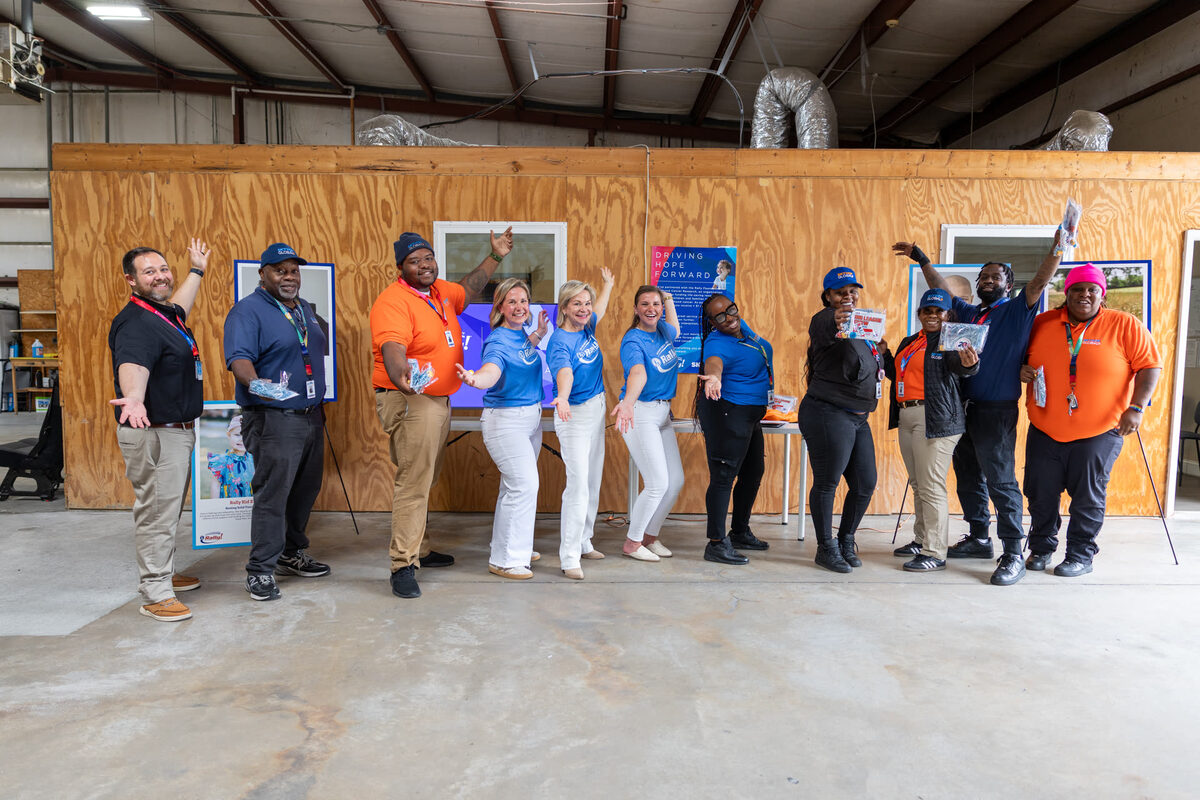 SkyHop and Rally Foundation teams celebrating at ATL station